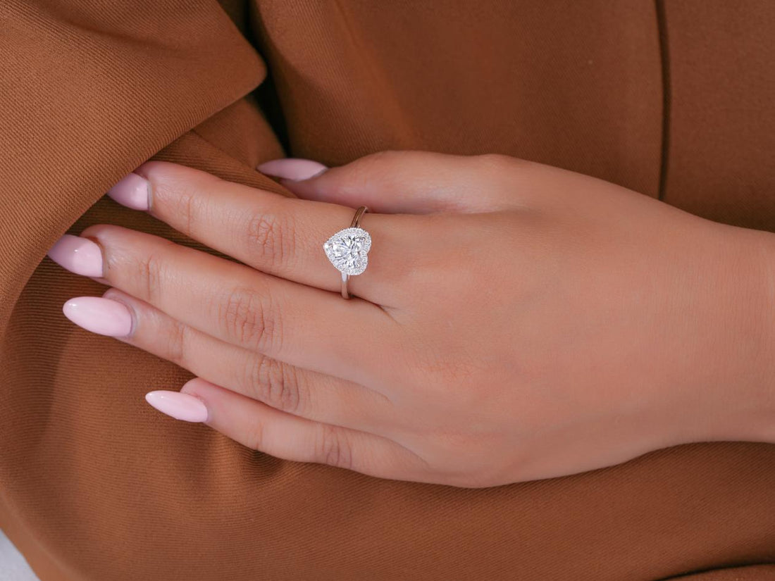 heart diamond ring in hidden halo engagement ring style.
