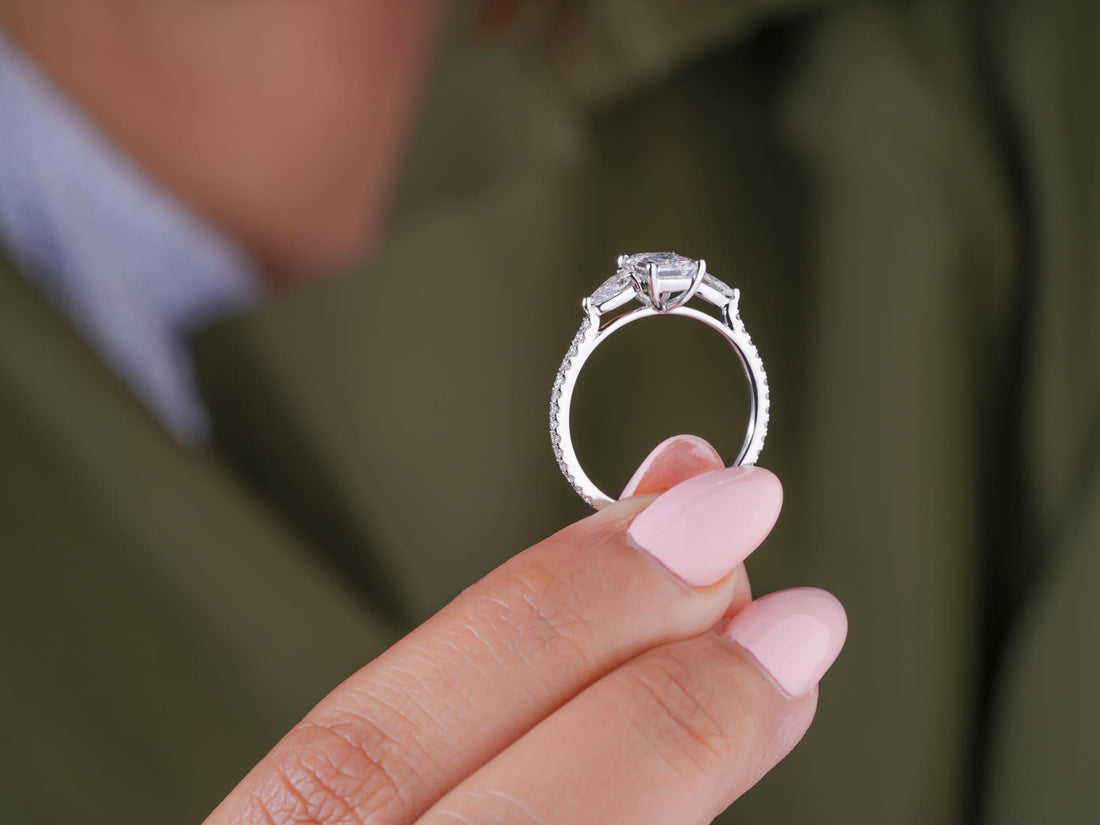 pear cut side stones in pave setting band ring.
