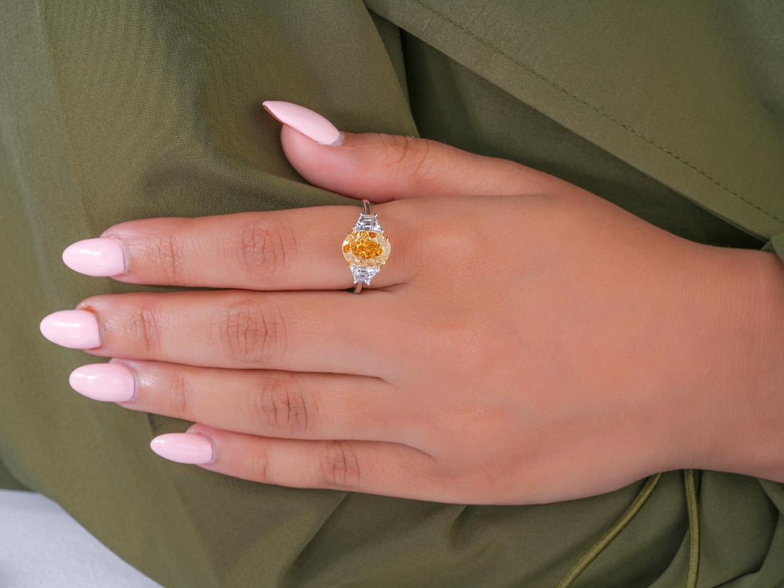 oval engagement ring in three stone diamond ring style.
