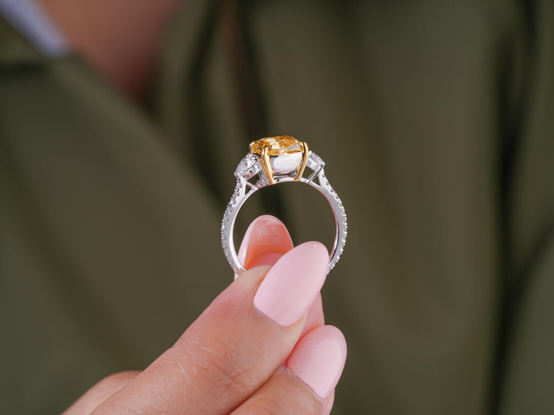trillion side stones on tapered shank ring.
