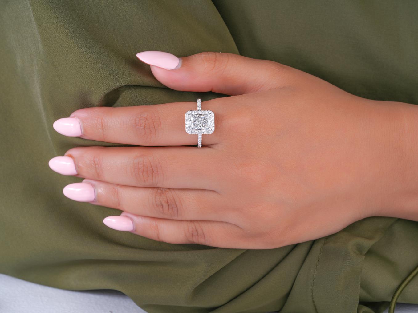 pave setting ring in halo setting engagement ring style.
