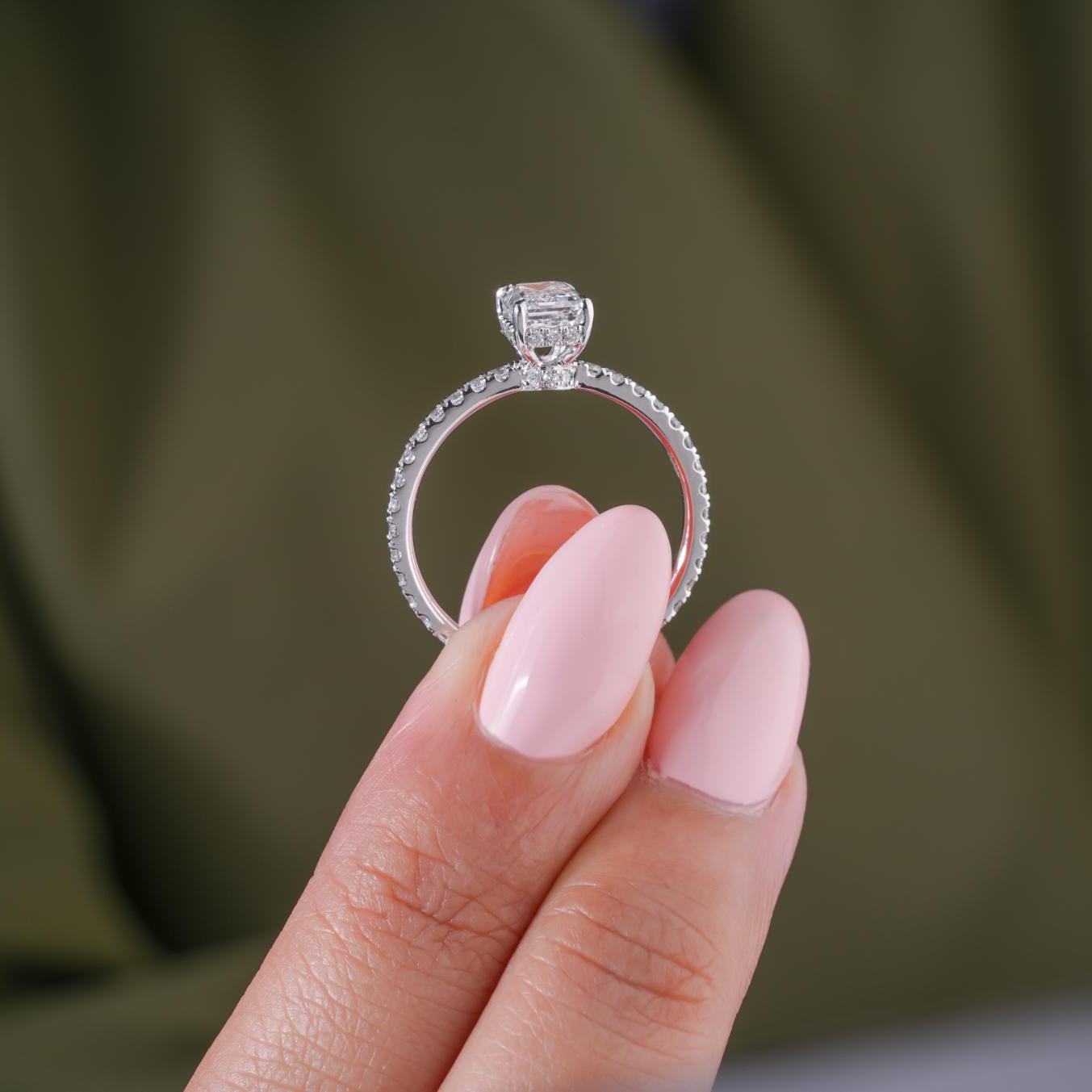 Lumera engagement ring with emerald diamond ring.
