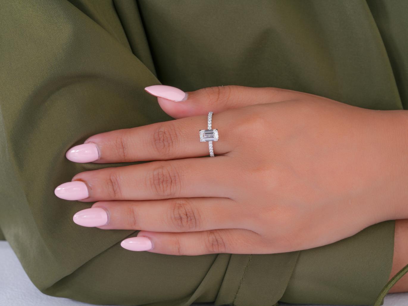 double hidden halo ring in emerald hidden halo ring style.
