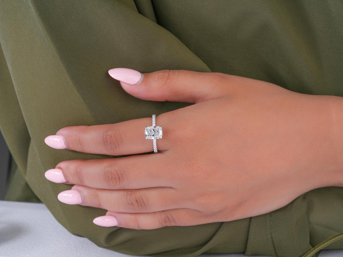 cushion cut engagement ring in bridge accent setting.
