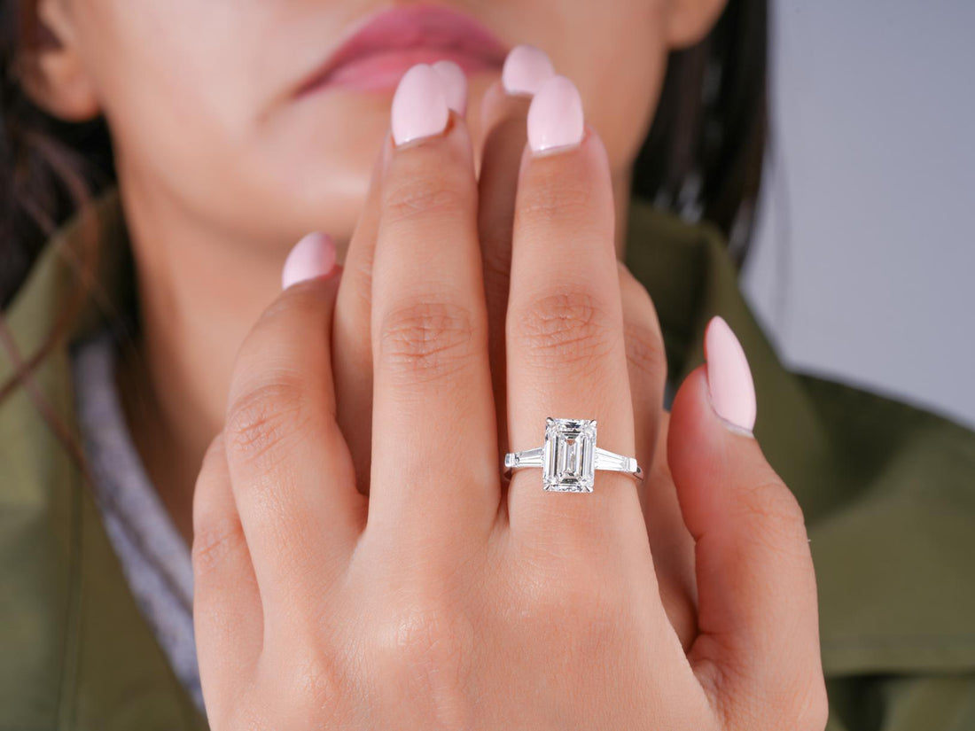 trilogy diamond ring in tapered baguette side stone style.
