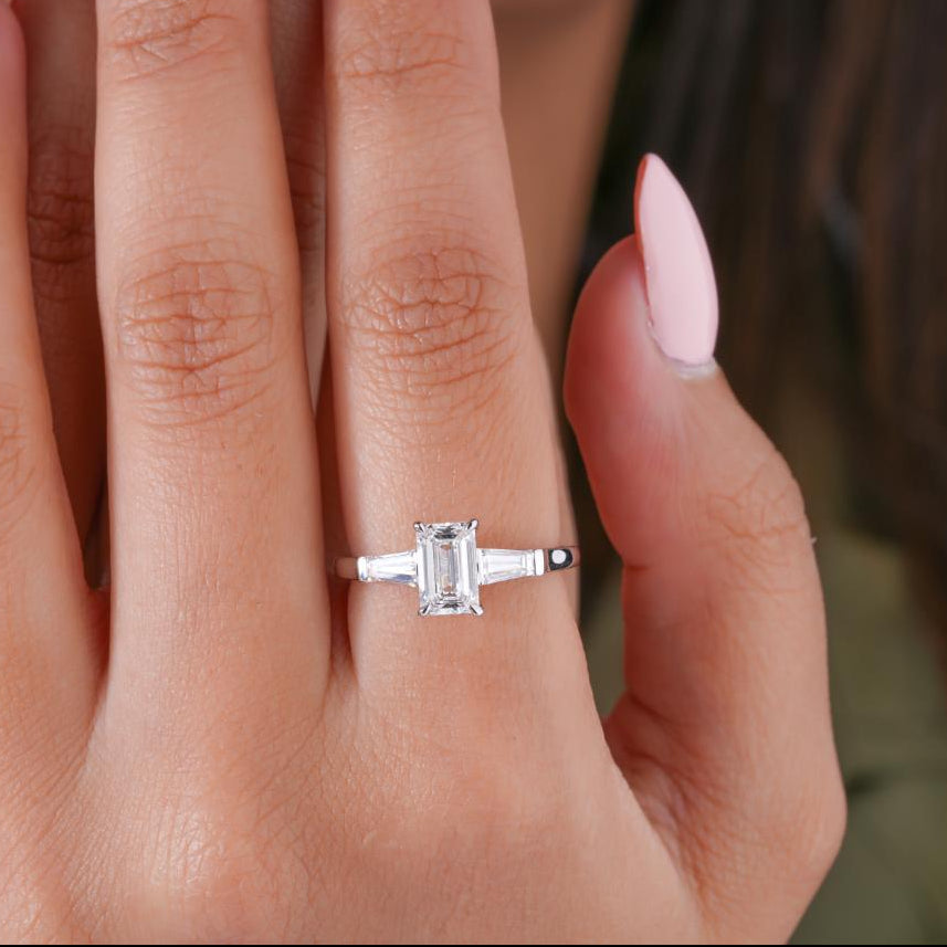 Tapered baguette side stones with Emerald with tapered baguette stones.
