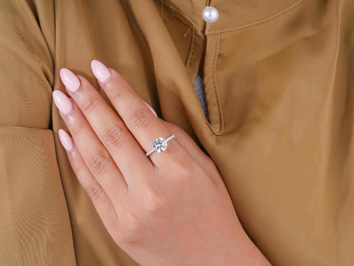 hidden halo engagement ring in pave set band ring style.