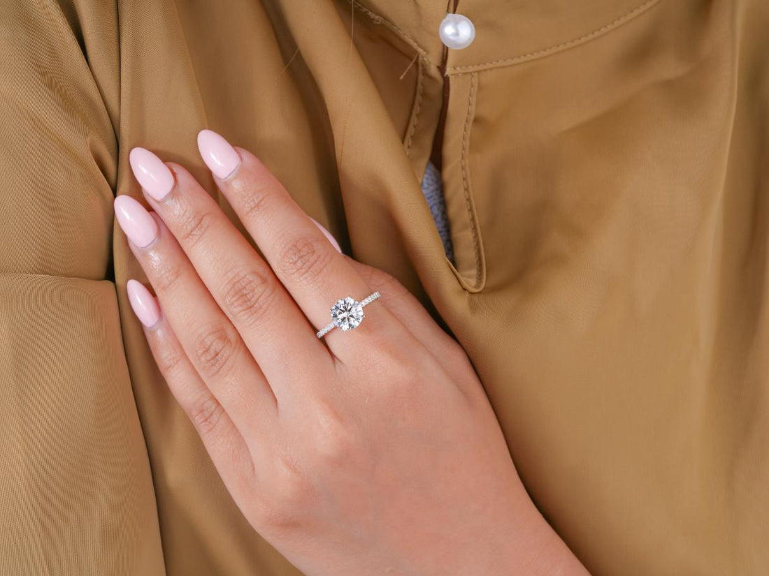 hidden halo engagement ring in pave set band ring style.