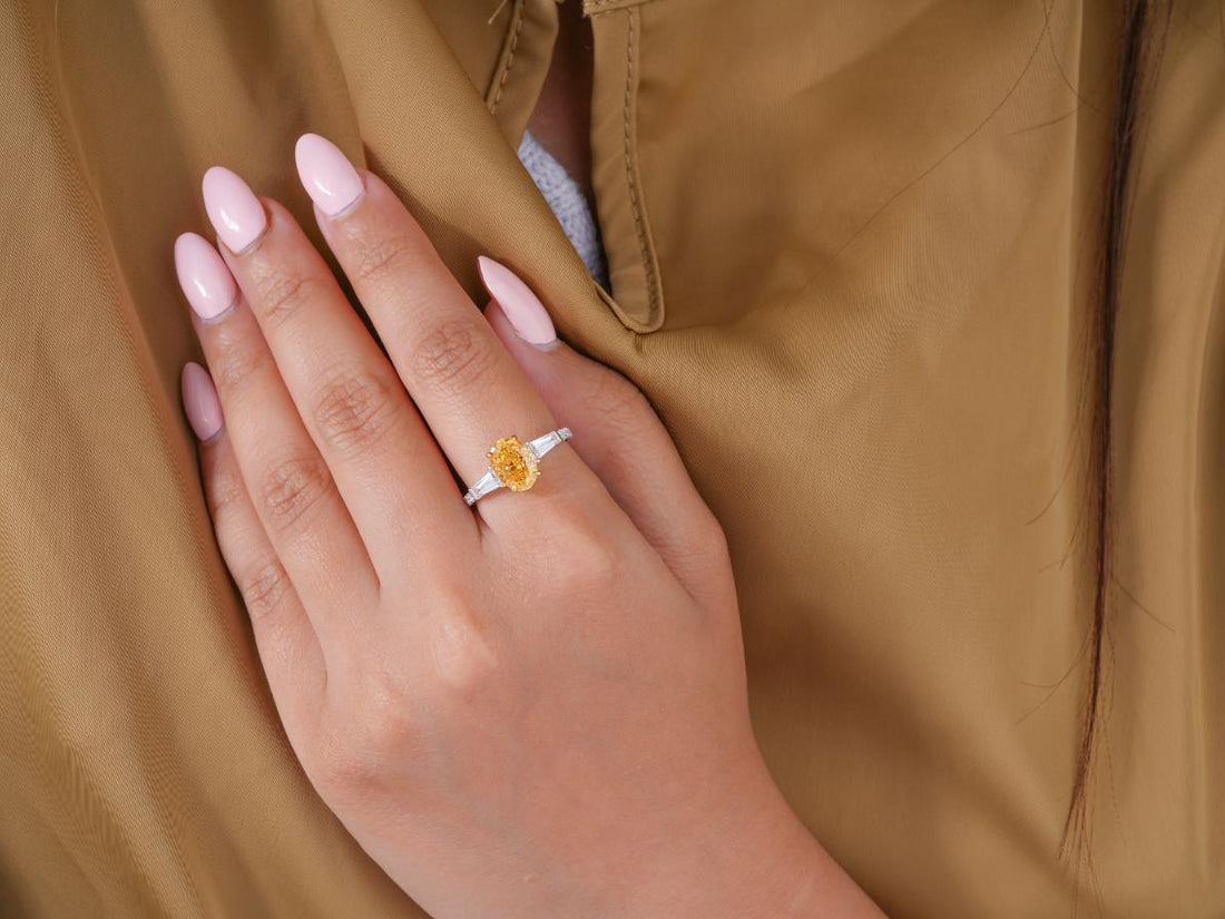 fancy yellow color stone ring on two tone gold ring.
