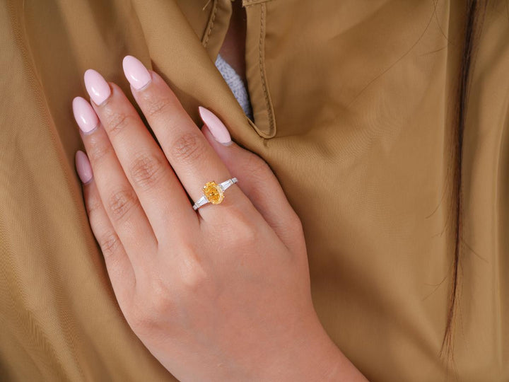fancy yellow color stone ring on two tone gold ring.
