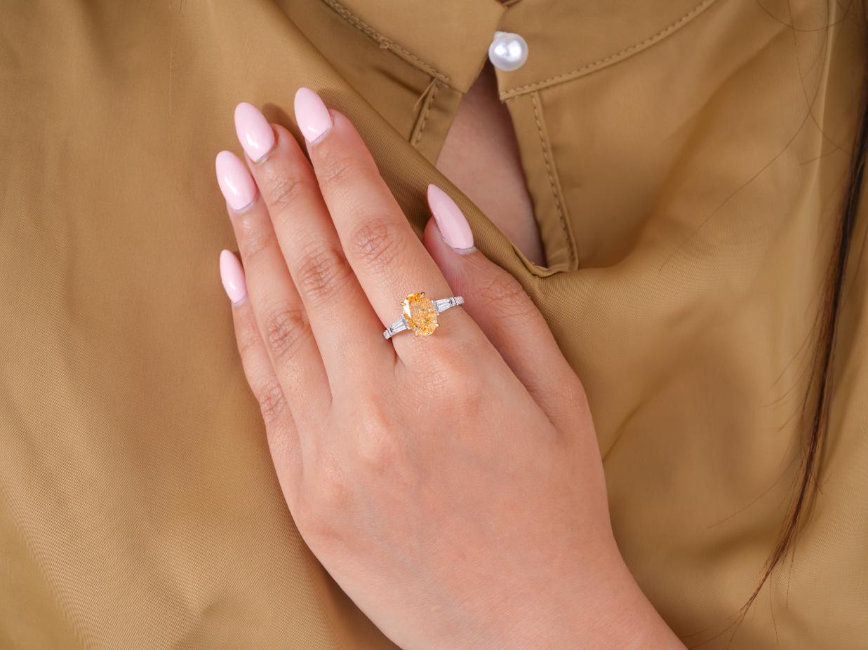 oval engagement ring in three stone engagement ring style.