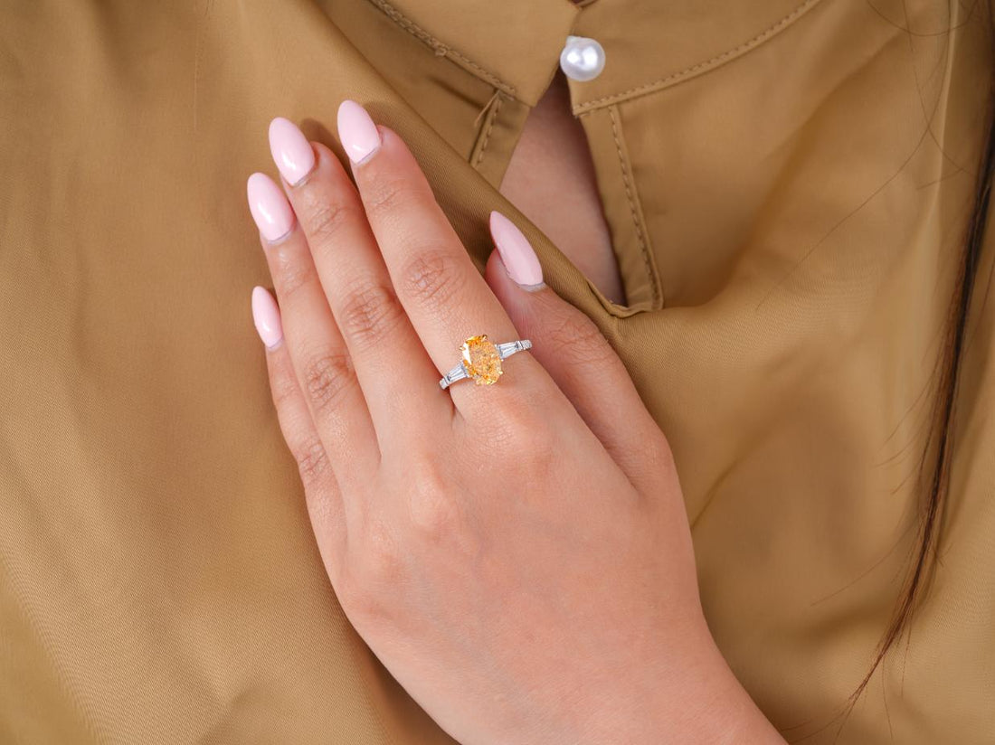 oval engagement ring in three stone engagement ring style.