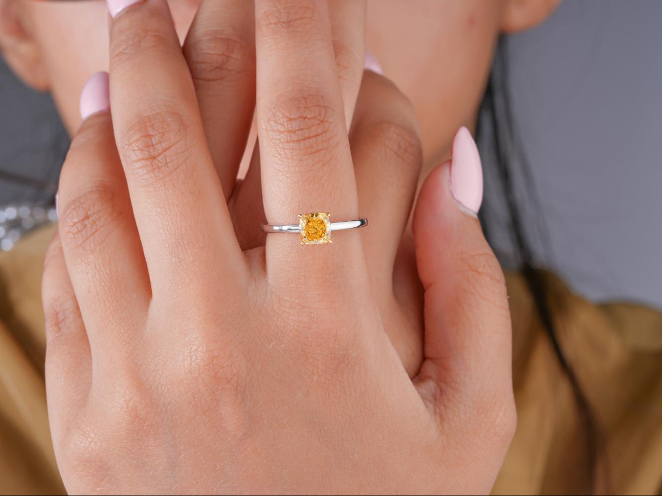 solitaire diamond ring with two tone gold ring.
