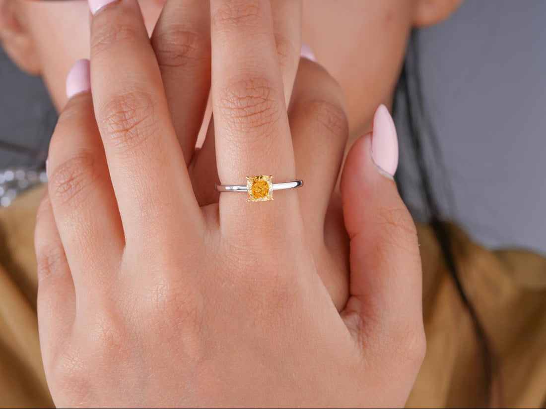 solitaire diamond ring with two tone gold ring.

