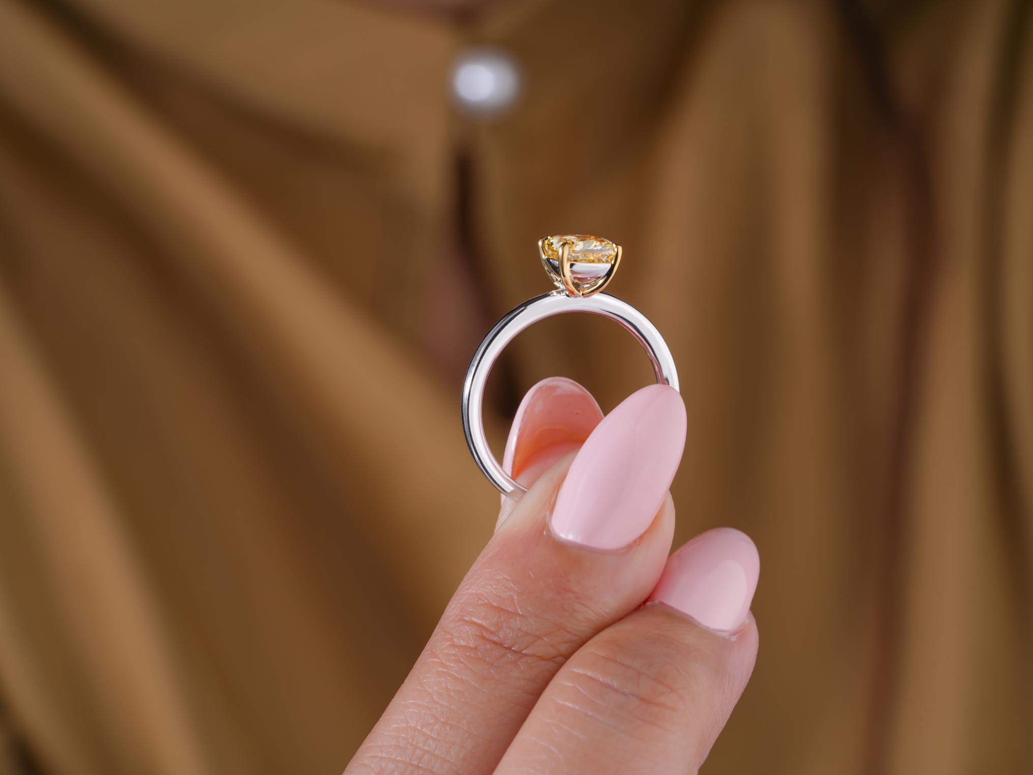 yellow cushion solitaire ring with solid gold ring.

