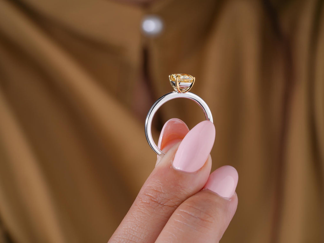 yellow cushion solitaire ring with solid gold ring.
