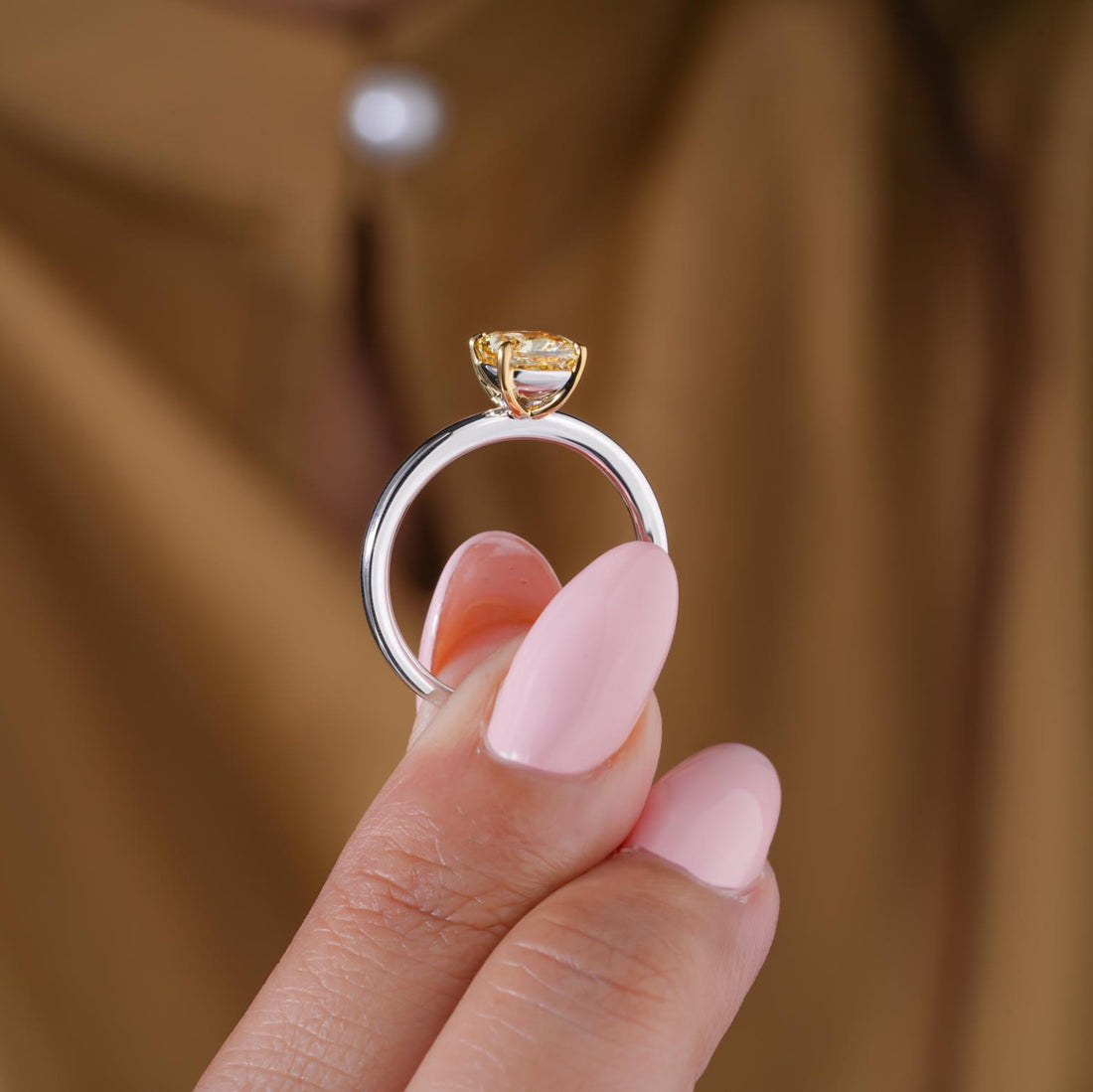 Claw prong setting with Yellow and white gold ring.
