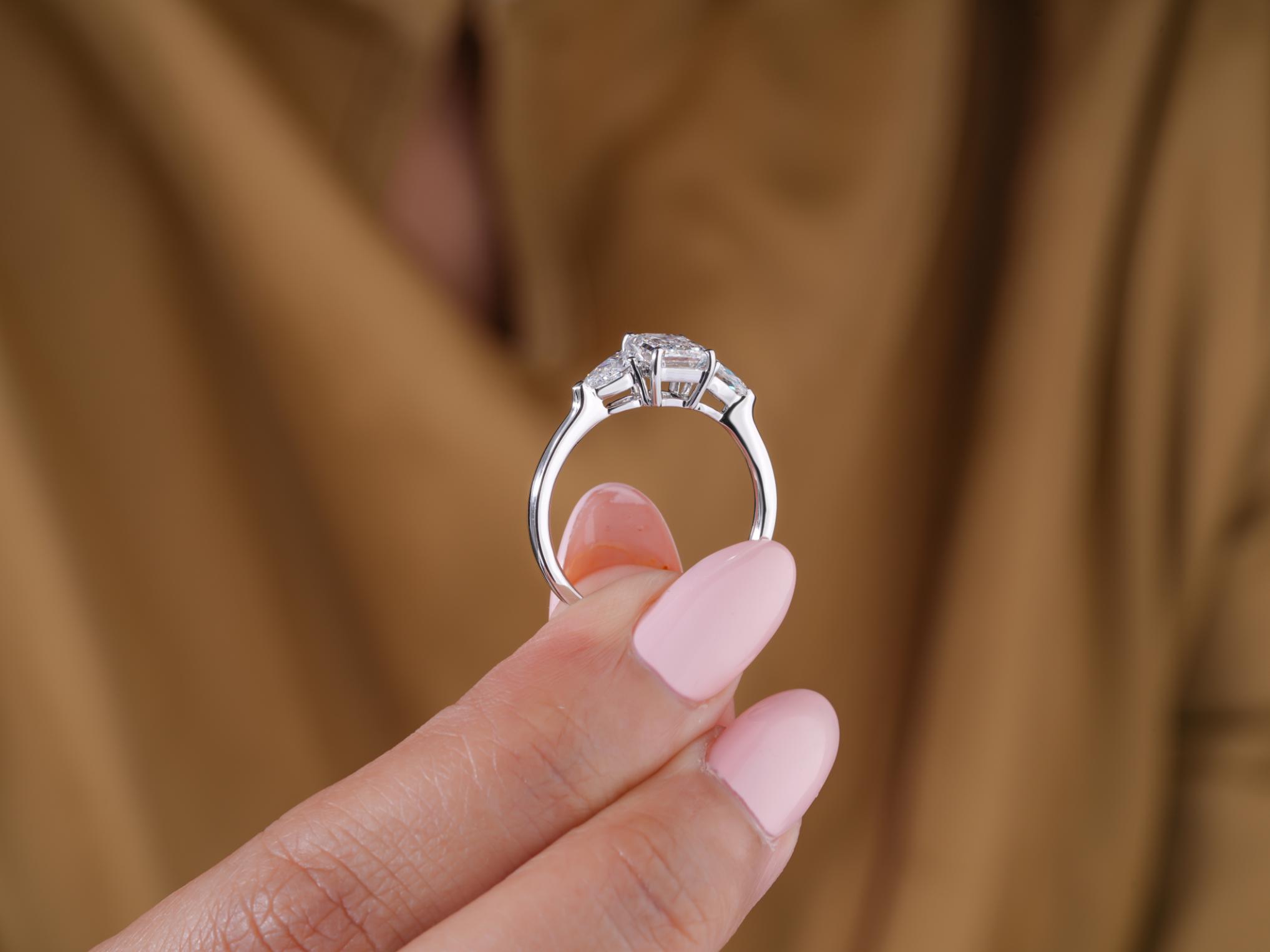 three stone ring with prong setting.
