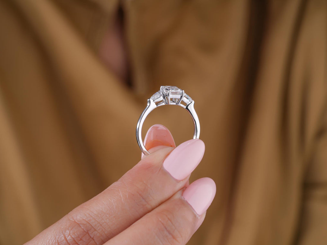three stone ring with prong setting.
