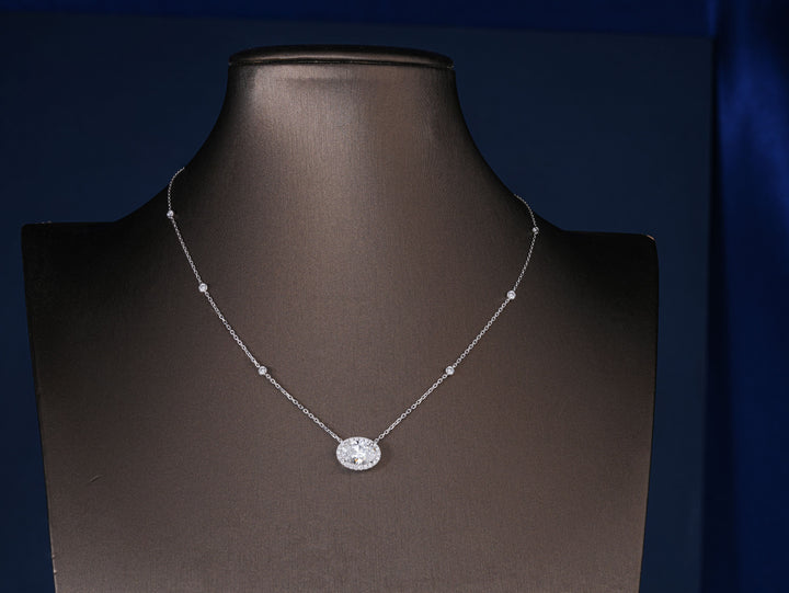 oval diamond halo pendent with 4 claw prong setting.
