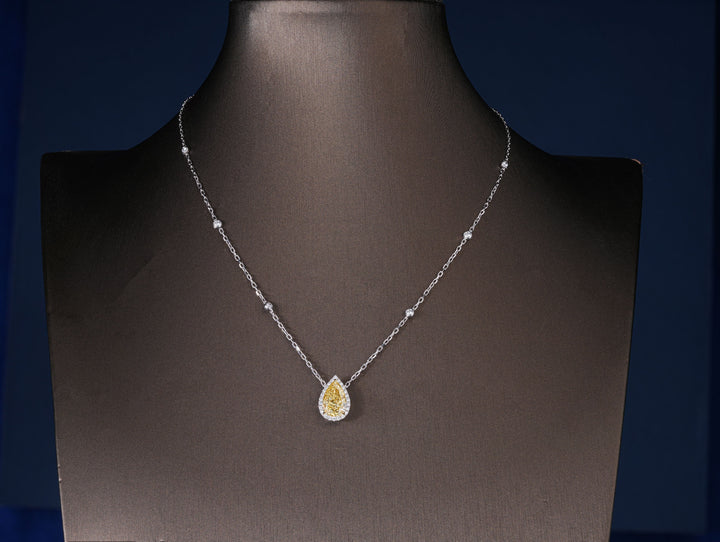 pear diamond pendant with yellow teardrop diamond halo pendant.