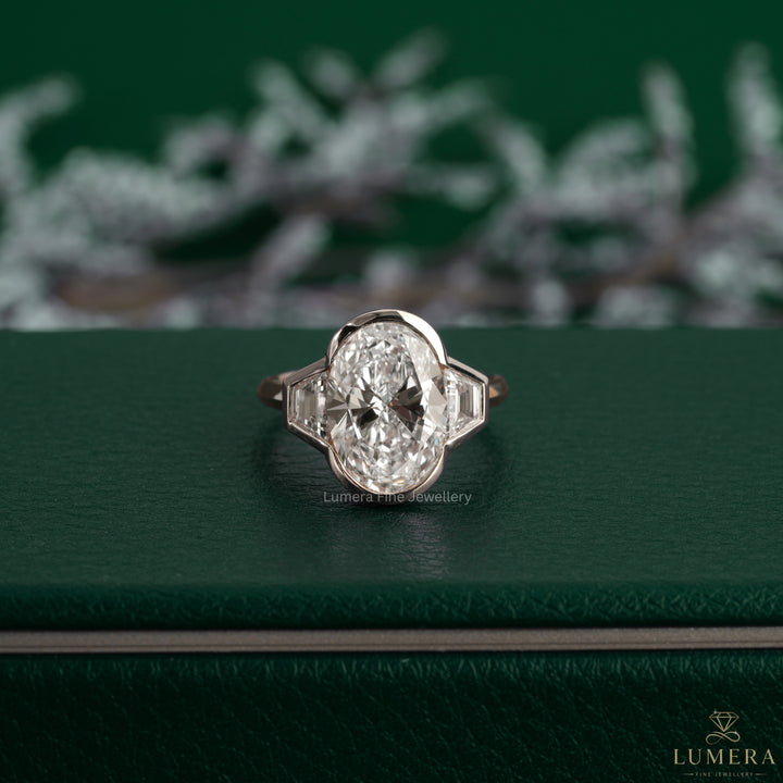 Three stone ring featuring an open basket setting.