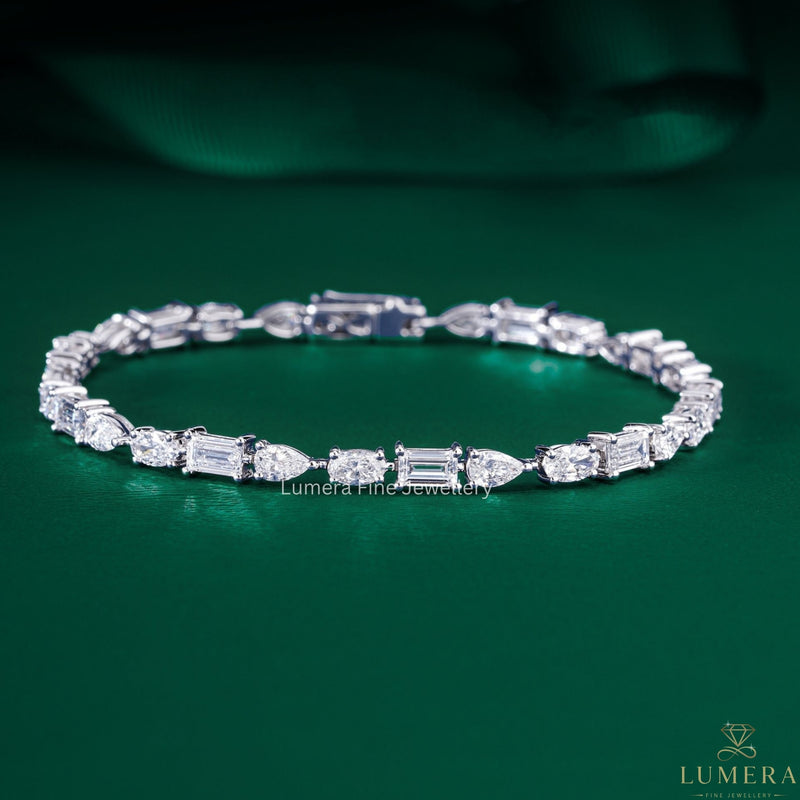 Baguette pear and oval diamond bracelet with mixed shape diamond tennis bracelet.