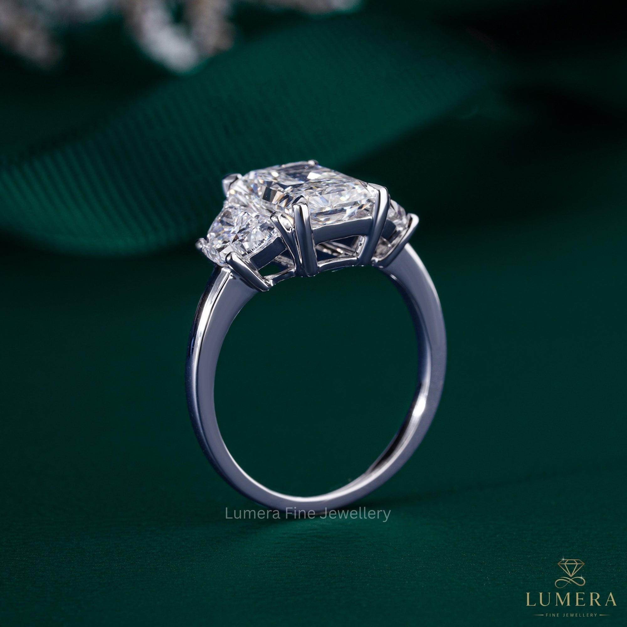 half moon cut side stone with 4 claw prong setting.
