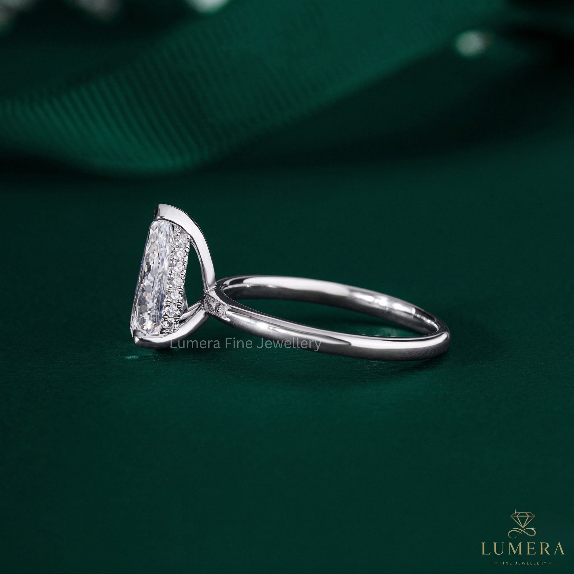 pear shaped ring with claw prong setting.