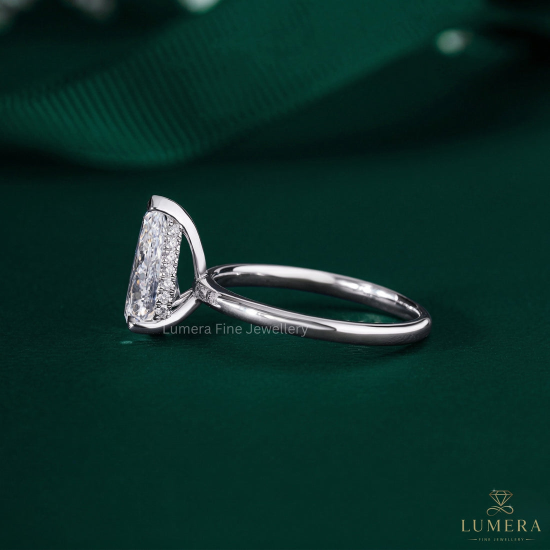 pear shaped ring with claw prong setting.