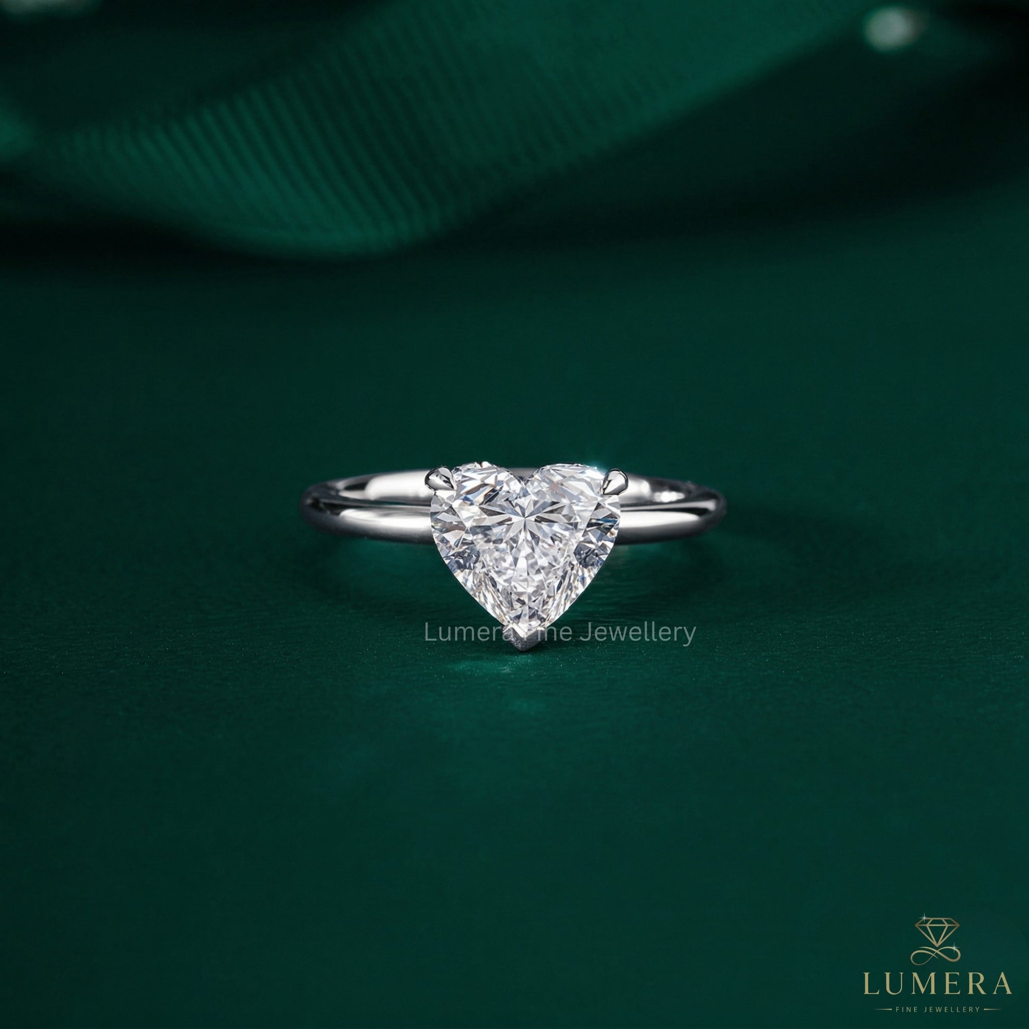 heart shaped engagement ring with heart cut ring.
