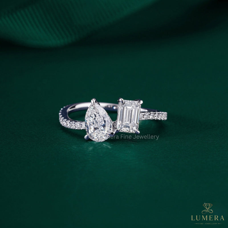 toi et moi engagement ring with pear and emerald cut ring.
