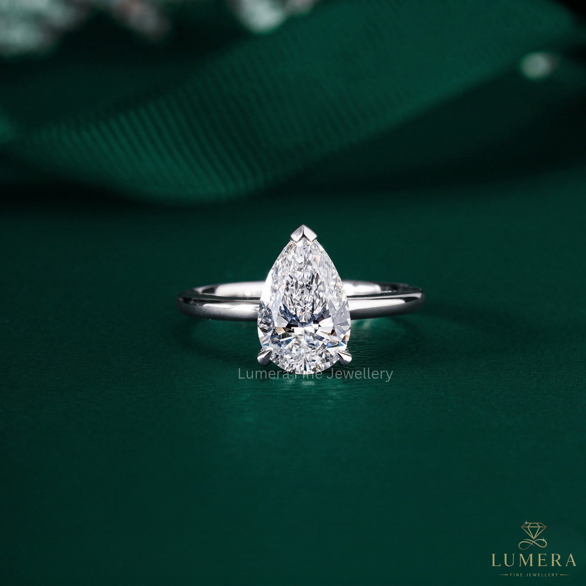 Pear Cut Engagement Ring with hidden halo ring.