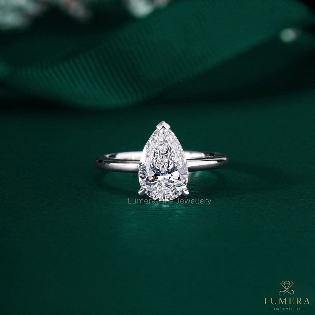 Pear Cut Engagement Ring with hidden halo ring.