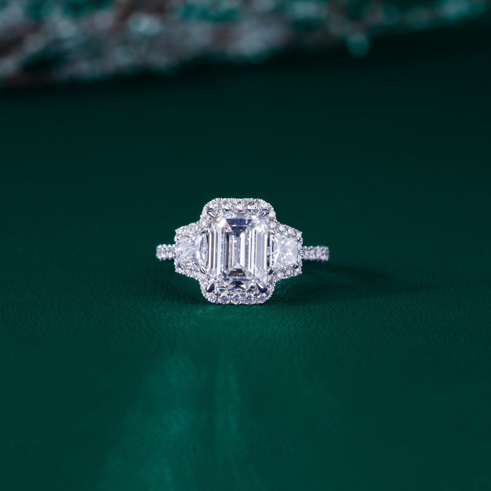 three stone emerald cut engagement ring.