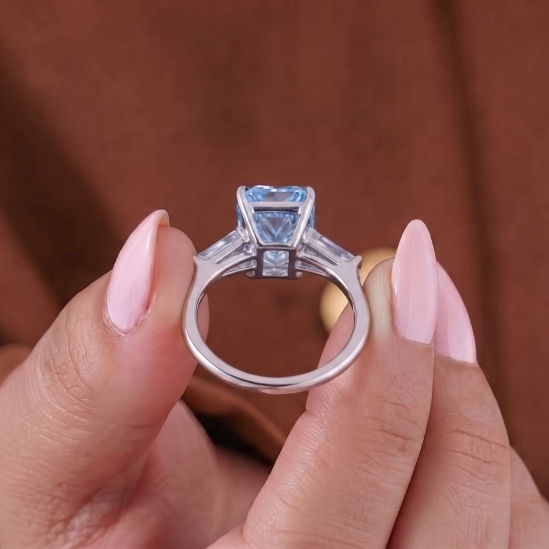 Blue diamond ring with radiant cut engagement ring.
