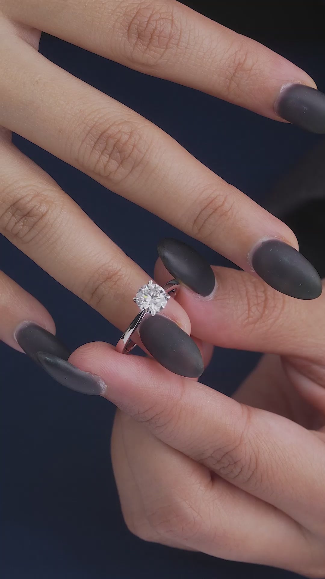 round cut solitaire engagement ring.