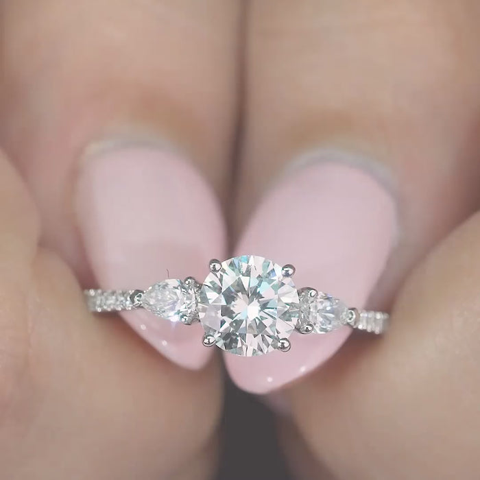 round cut engagement ring on pave band.
