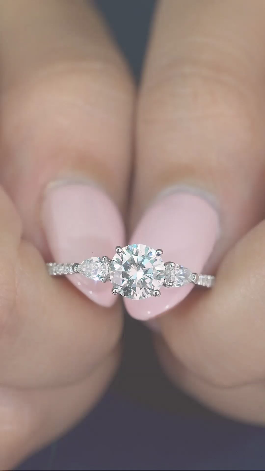 round cut engagement ring on pave band.
