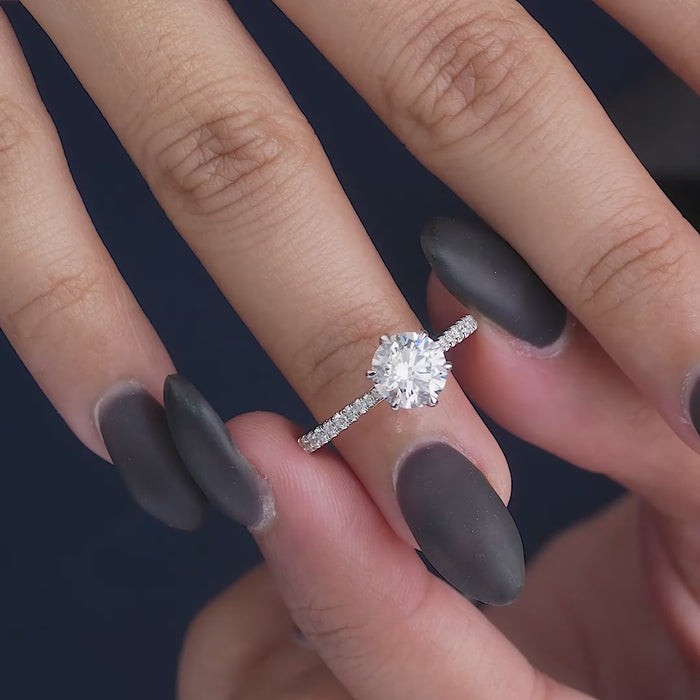 round cut engagement ring on solid gold ring.
