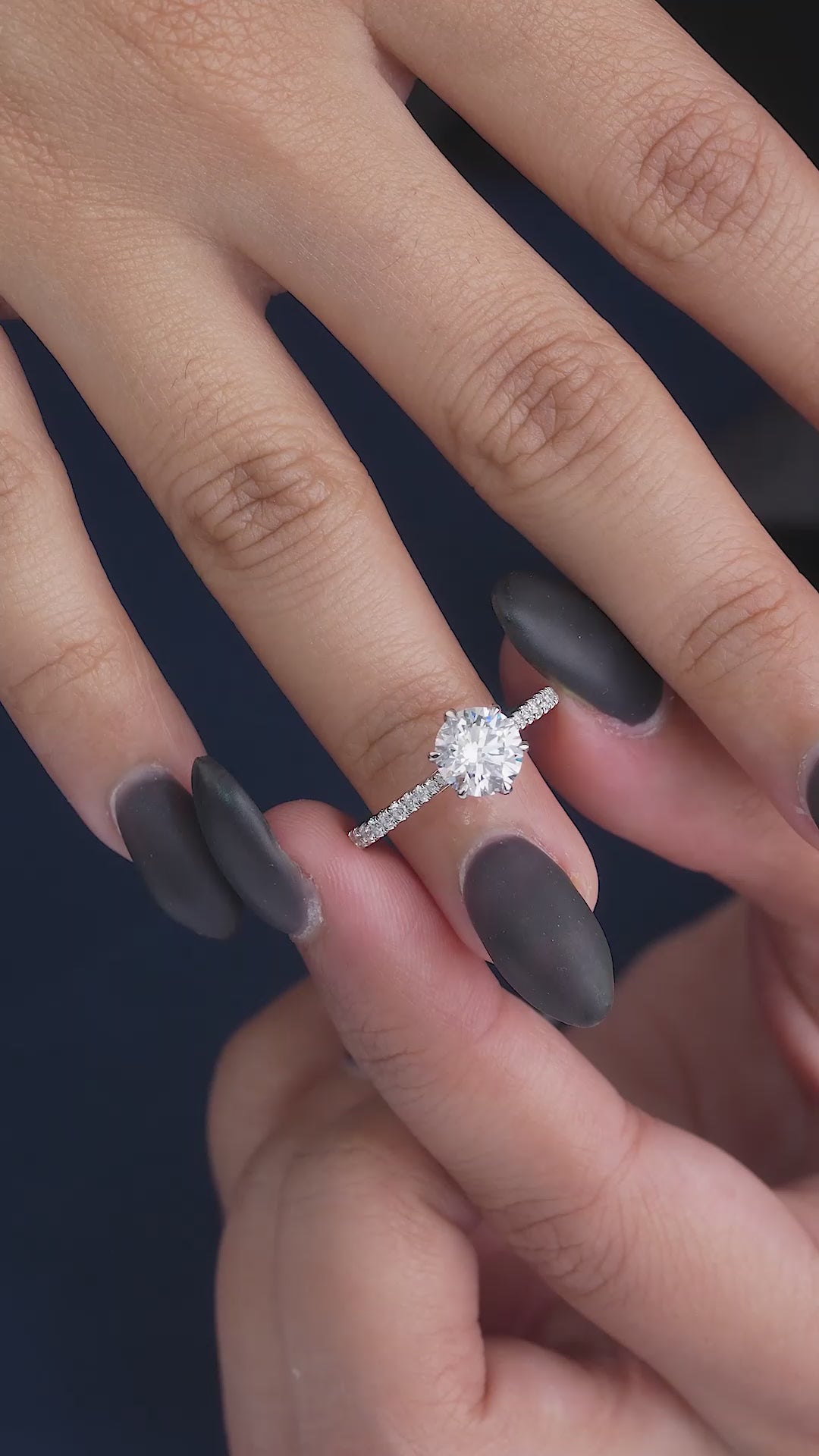 round cut engagement ring on solid gold ring.
