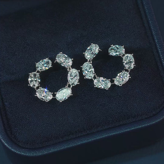 oval stud earrings with lab grown diamond earrings.
