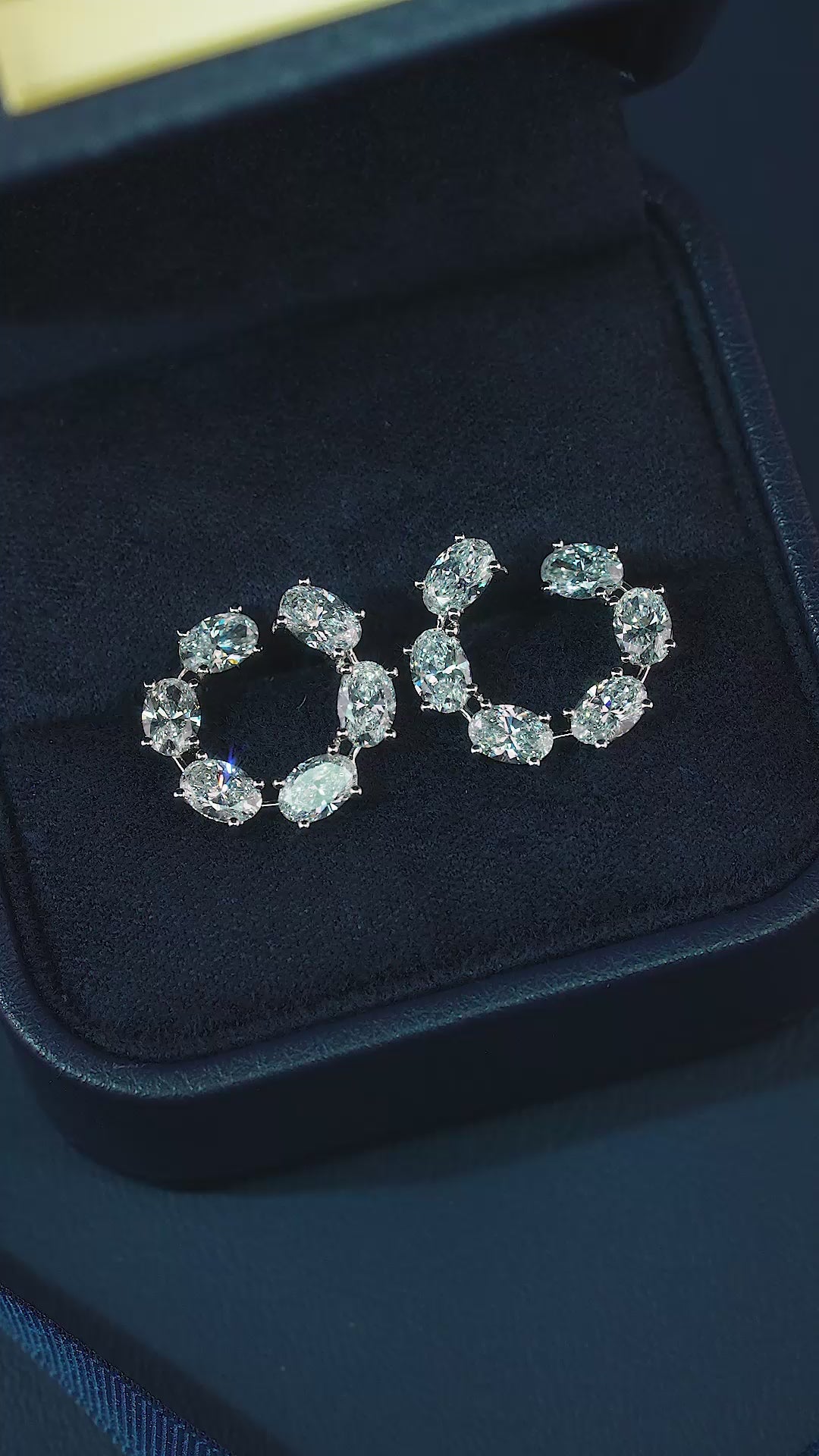 oval stud earrings with lab grown diamond earrings.
