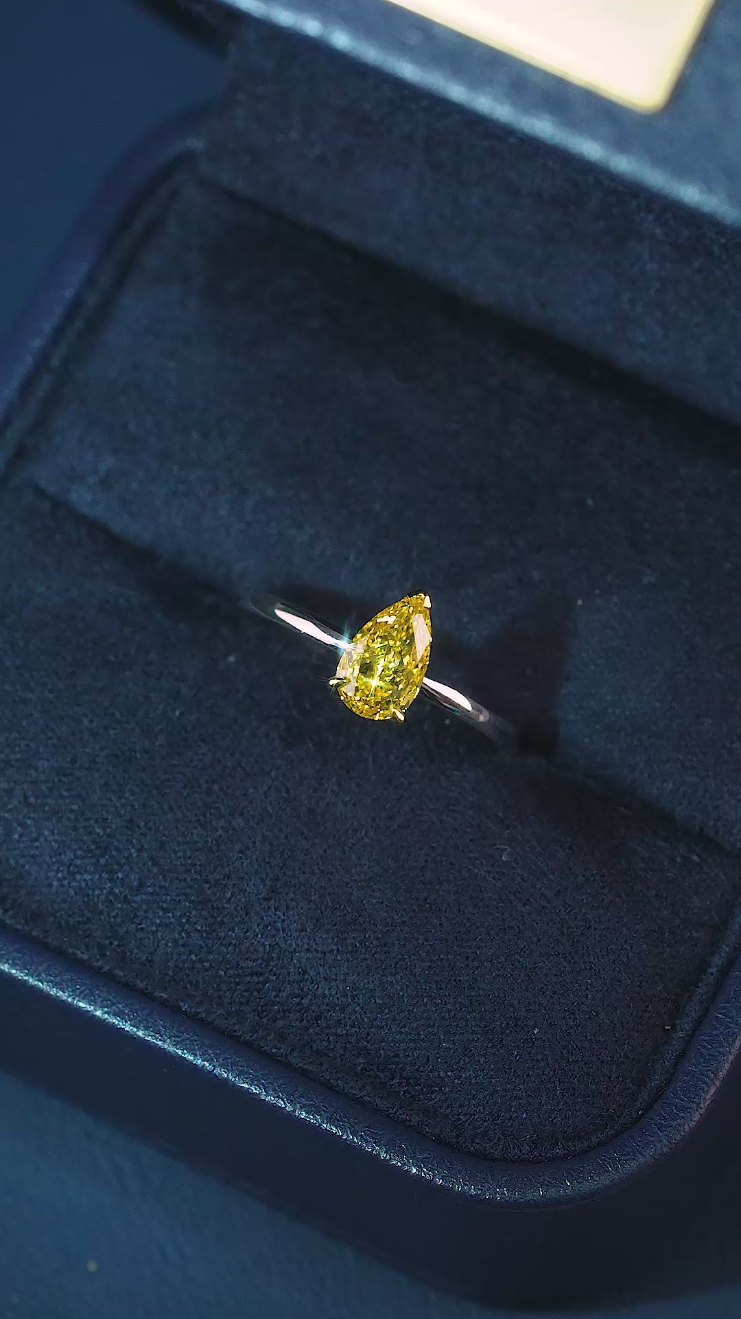 yellow diamond pear cut ring in v prong set style.

