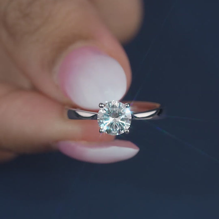 round solitaire ring with solid gold ring.
