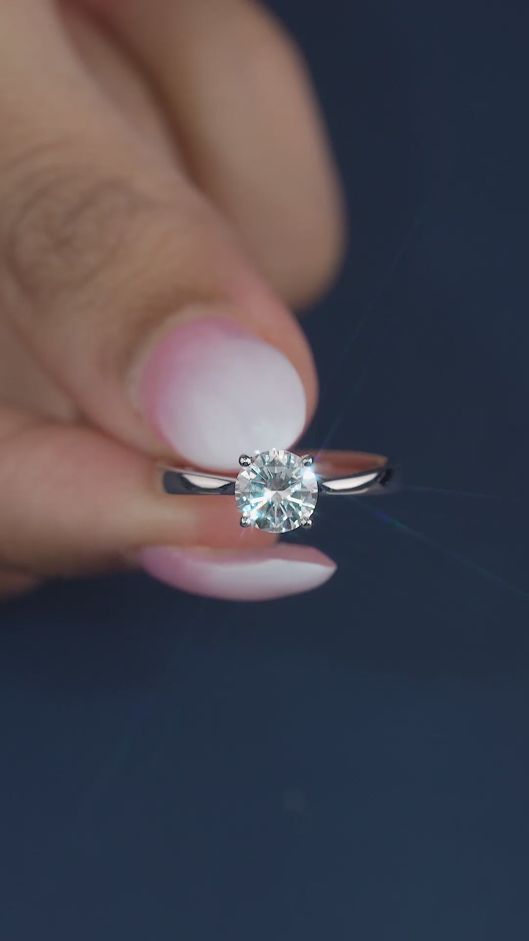 round solitaire ring with solid gold ring.
