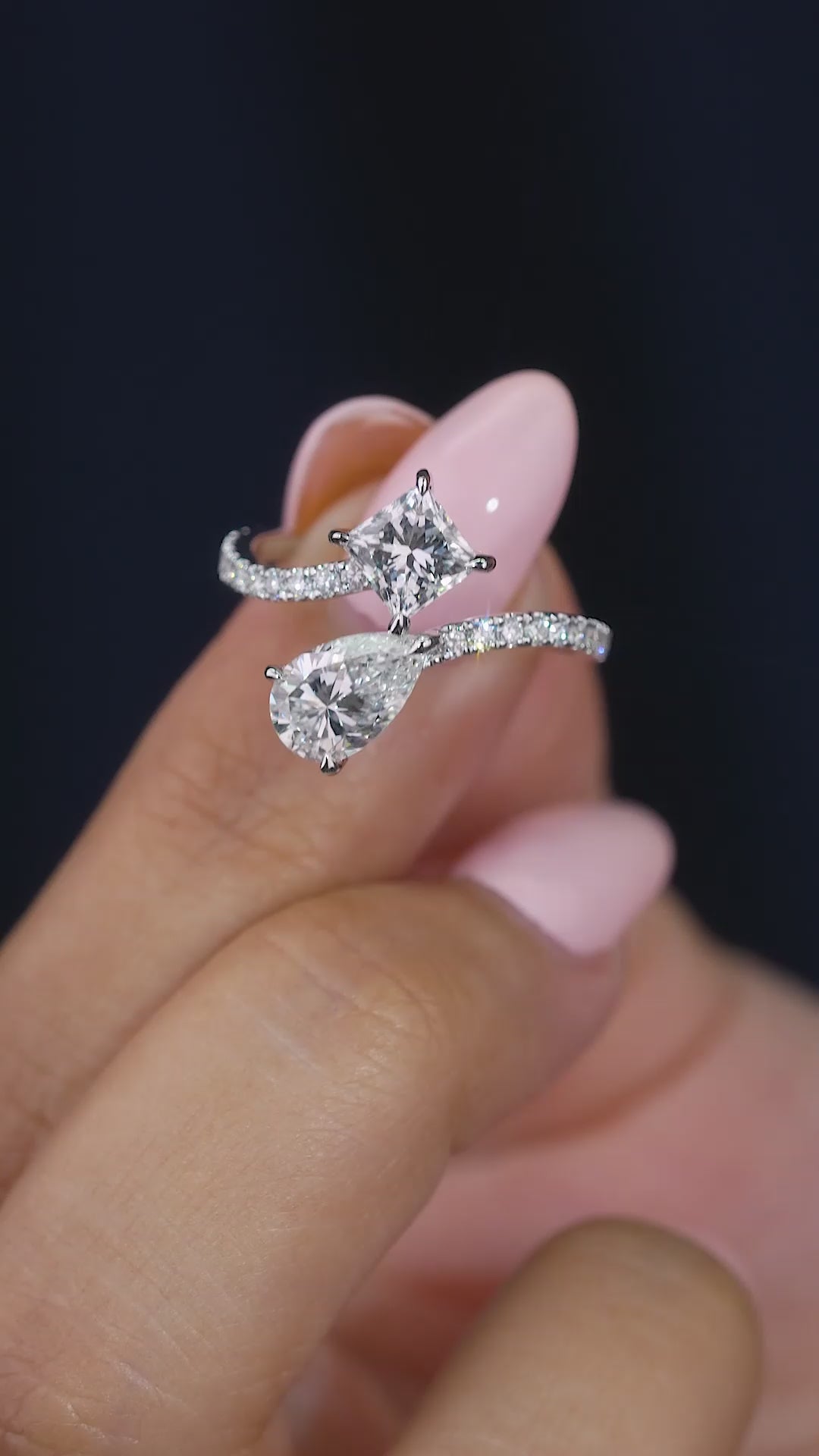 pear engagement ring with princess diamond ring.
