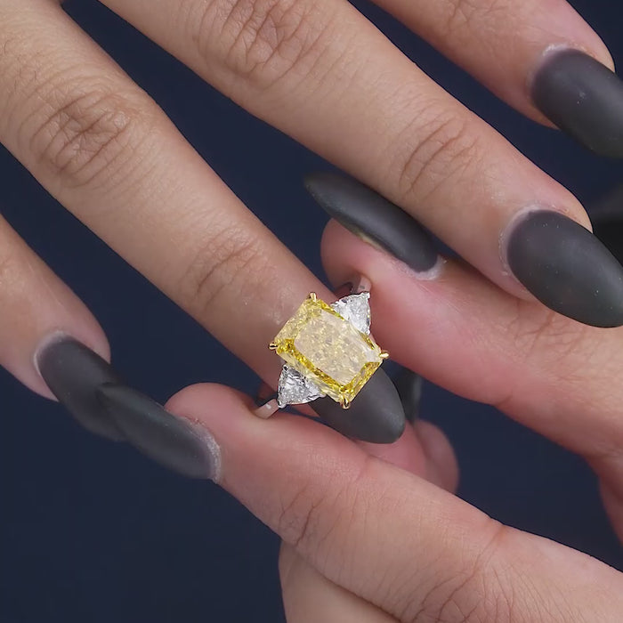 yellow diamond engagement ring on two tone ring.
