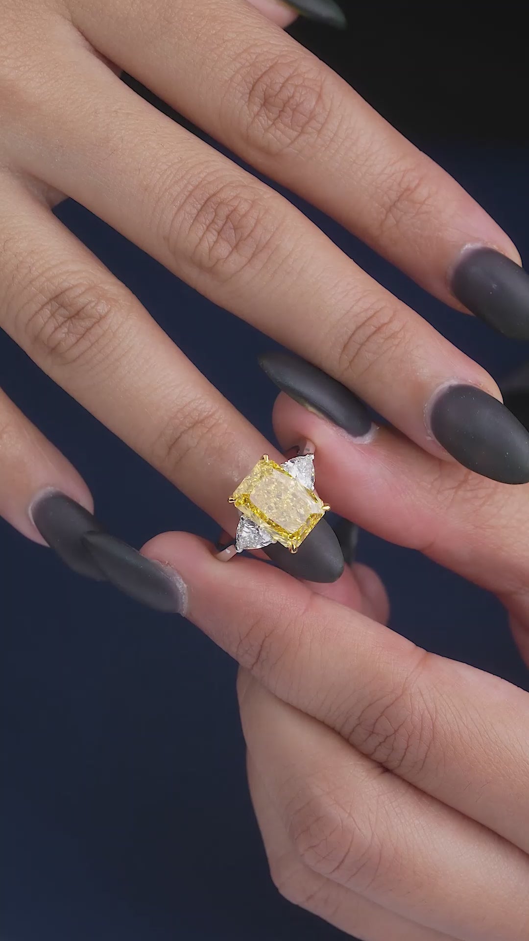 yellow diamond engagement ring on two tone ring.
