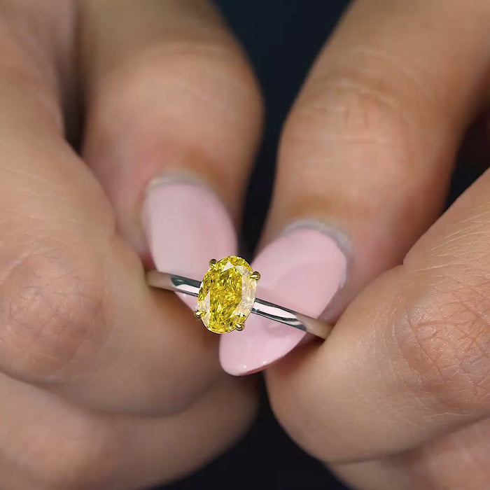 yellow diamond engagement ring with solitaire setting ring.